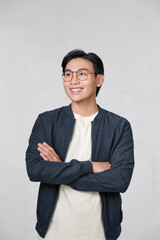 Wall Mural - Young Asian man posing on white background