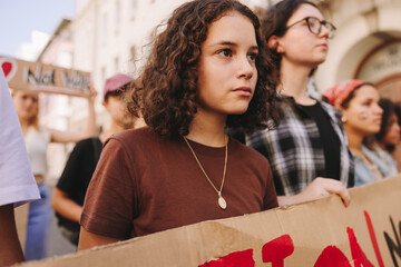 Wall Mural - Diverse young people protesting against war