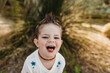 © Cavan Images - Close up portrait of cute young toddler boy with smiling