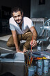 © Cavan Images - young painter working in his workshop