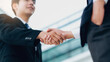 © Cavan Images - Businessmans handshake after good deal.