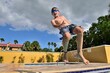 © Cavan Images - Boy has fun jumping into a hotel pool on vacation