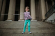 © Cavan Images - young girl standing on steps in front of building in Washington DC