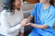 © Jirapong - Portrait of a female doctor holding a patient's hand to encourage the fight against disease.