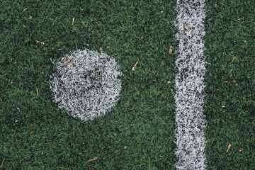 penalty spot, solid white long line and round white point on green background