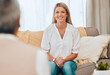 © Courtney/peopleimages.com - Therapy, happy woman and psychologist sofa in a office for mental health support and wellness. Consulting therapist, young female and mind and healthcare check of a patient speaking to a professional