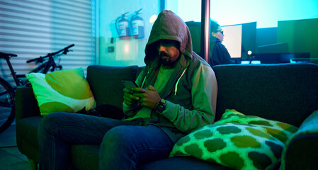 Leinwandbilder - Man, dark or phone hacking in neon garage on cybersecurity app, software programming or phishing coding. Hacker, technology or planning virus code on night sofa ideas, vision or password fraud scam