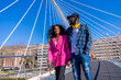 © unai - Young african american women in the city, lifestyle concept friends, having fun on a bridge