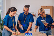 © Zamrznuti tonovi - Volunteers working in a charity donation center and packing clothes and food