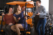 © caftor - family of tourists of different generations hire bike carriage