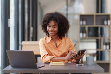 Wall Mural - Accountant black woman working on laptop and do document, tax, exchange, accounting and Financial advisor concept