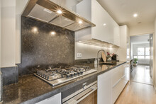 Interior Of Contemporary Kitchen With Chrome Appliances