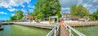 Panoramic cityscape  with embankment and marina in Naantali town at sunny summer day. Finland