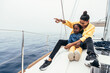 © ADDICTIVE STOCK - Cheerful black woman showing view to boy