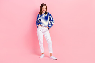 Poster - Full body portrait of lovely cute young lady put arms pockets posing isolated on pink color background