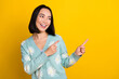 © deagreez - Photo of adorable cheerful glad lady wear stylish spring outfit look empty space presenting novelty isolated on yellow color background