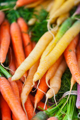 Wall Mural - Stack of colorful carrots on a market stall