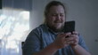 © Marco - One excited fat man celebrates success in front of computer. close up male person face feeling happy. WOW winner emotion