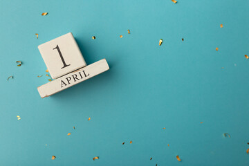 Wall Mural - April 1st. Image of april 1 wooden calendar on blue background. Spring day, empty space for text. All Fool's Day