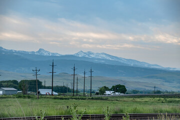 Wall Mural - Rural Eastern Oregon Town and Telephone Lines in Country with Wallowa Mountains in Background