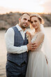 © omelnickiy - bride blonde girl and groom near the river