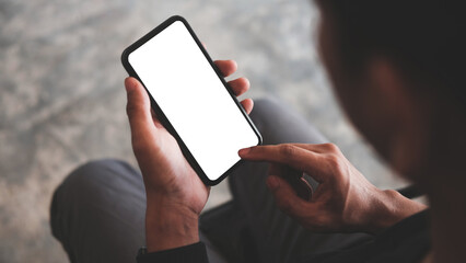 close up view man holding mock up smart phone. blank screen for your advertising text..