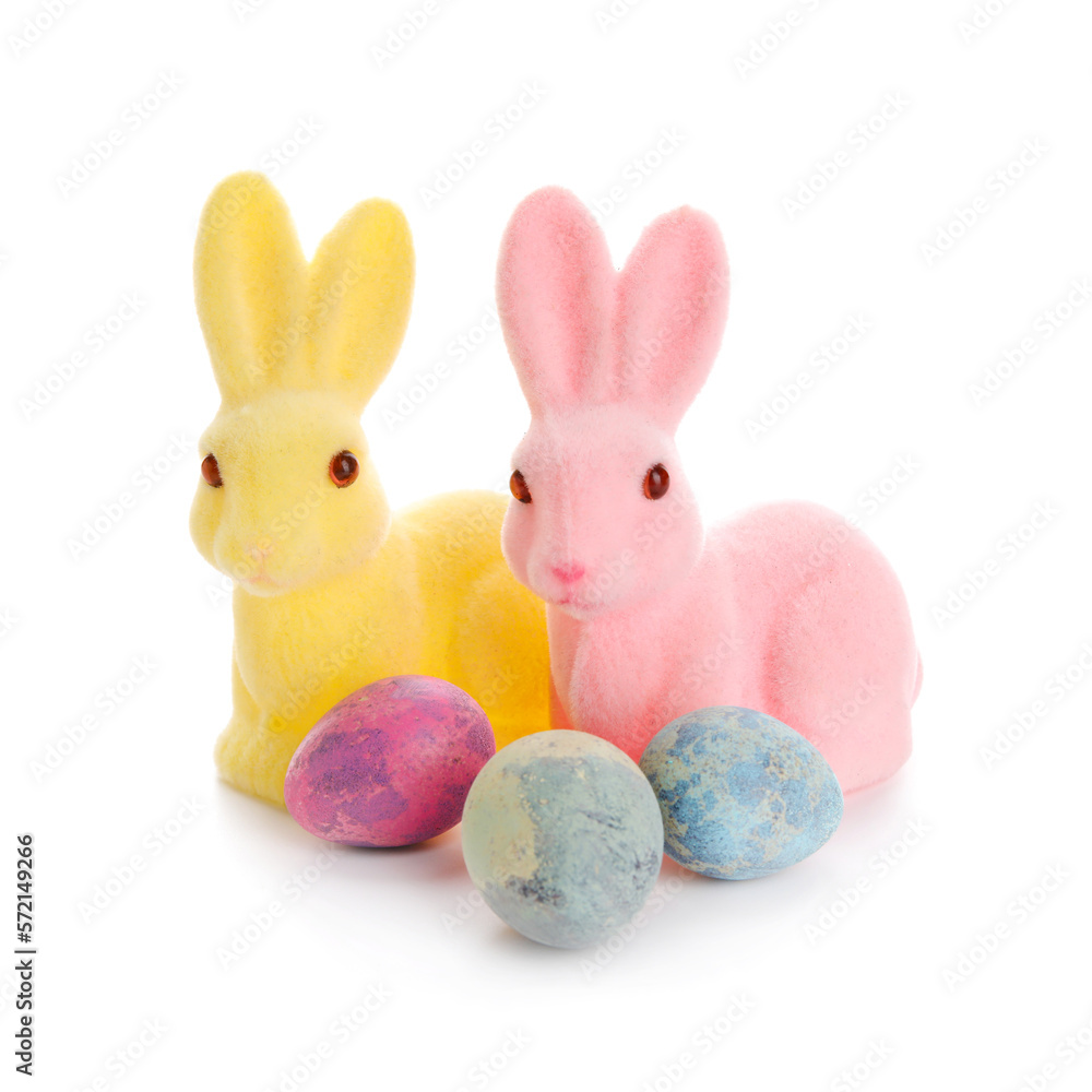 Easter bunnies and painted eggs isolated on white background