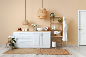 Interior of bathroom with sink, counters and shelving unit