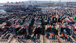 © Matt Gush - Daytime aerial view of an intermodal container shipping stock yard unloading vessels at port.