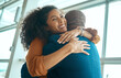 © Nina Lawrenson/peopleimages.com - Couple hug, reunion at airport and travel with love, care and relationship, happy to see partner with black people. Hello, happiness and commitment, traveling and embrace, together and greeting