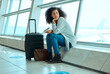 © Nina Lawrenson/peopleimages.com - Airport, travel delay and depressed woman sad for immigration, passport or schedule problem. Young USA person with luggage and stress, anxiety or thinking of flight fail, crisis or identity mistake