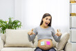 © Andrii - Photo of positive pregnant woman with pink and blue papers on the stomach which mean gender of future baby.