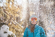 © Cavan Images - Woman in ski goggles and helmet in backlit snow scene in New Hampshire