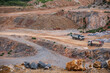 © Cavan Images - dumb trucks working at gravel mine in Thailand