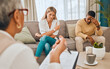© Courtney/peopleimages.com - Couple on sofa, psychologist with clipboard for mental health advice and consulting in office. Stress, anxiety and depression, sad black man and woman and healthcare therapist in consultation room.