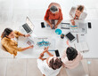 © Lumeez/peopleimages.com - Collaboration, teamwork or consulting top view in business meeting for company growth, strategy review or teamwork in office. Group of startup women for SEO, schedule or planning calendar research