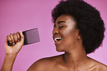 Canvas Print - Singing, hair or afro comb on beauty background in fun grooming routine, natural skincare play or growth texture karaoke. Black woman, happy or hairstyle brush microphone on isolated pink performance