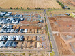 © Austockphoto - Aerial view of new houses under construction in an urban subdivision
