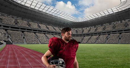 Sticker - Composition of male american football player holding his helmet over sports stadium