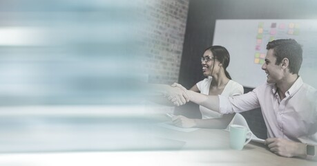 Poster - Composition of happy diverse business team shaking hands with motion blur