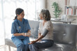 © NanSan - Young asian caretaker with 60s asia elderly woman consulting and encourage, take a history and recommend the right treatment to live happily in retirement, Measure blood pressure and heartbeat