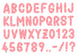 手書きのアルファベットと数字。ドットの入ったベビーピンク色のフォント。