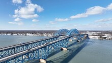 Beautiful South Grand Island Bridge Crossing Niagara River With Cars And Trucks Driving Under Blue Sky And Clouds 