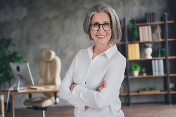 Sticker - Portrait of experienced lawyer aged lady toothy smile good mood crossed arms modern office building inside