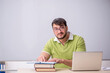 © Elnur - Young male teacher student in the classroom