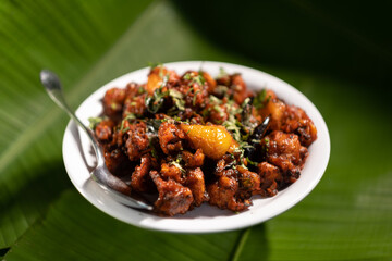 A serving of 'gobi 65', a vegetarian dish made from fried cauliflower and based on the 'gobi chicken' recipe originating from southern India.