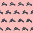 Seamless vector pattern with silhouettes of bunnies on pink. Easter endless background, wrapping paper. Minimalist design.