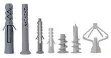 Plastic Dowels Of Various Types For Fixing Screws In The Wall On An Isolated Background. Construction Accessories Used For Repairs.