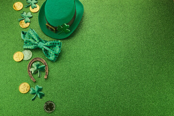 Wall Mural - St Patricks Day frame of shamrocks, gold coins and leprechaun hat over a glittery green background