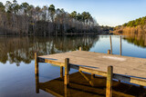 Fototapeta Na sufit - Eutawville, South Carolina sunset near Lake Marion with boat dock and water landscape view at Fountain lake in spring evening with nobody
